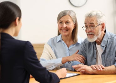 A young lady with an elderly couple discussing Probate Probate Process - Legacy Law Centers