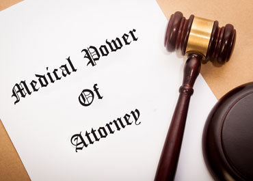 A document titled Medical Power of Attorney with a gavel on top - Legacy Law Centers