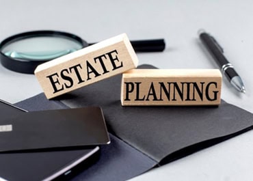 Wooden sign with 'Estate Planning' written on it, representing estate planning fundamentals. - Legacy Law Centers